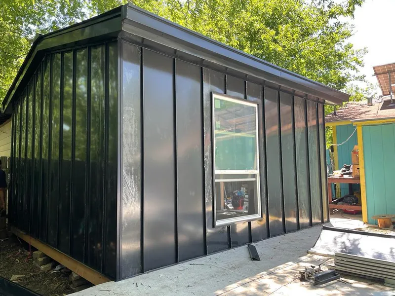 Black standing seam metal wall panels for Roof Inspection in SeaTac